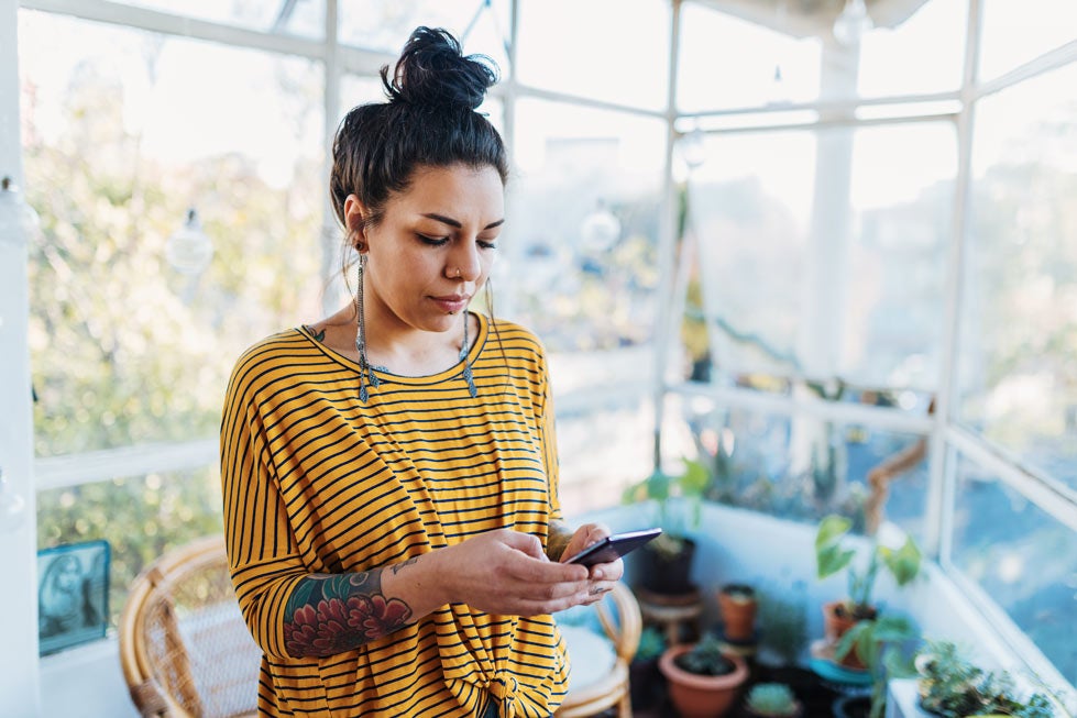 Young woman looking at phone
