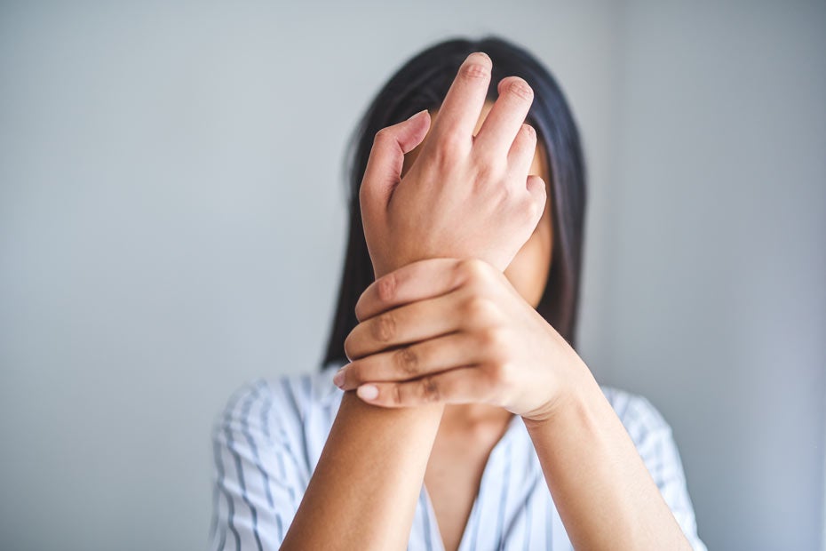 Woman grabbing wrist