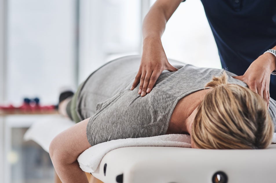 Women getting check-up from chiropractor