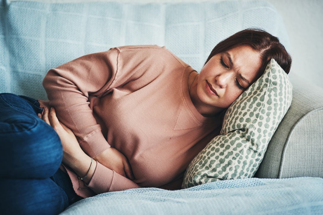 Woman not feeling well in gut